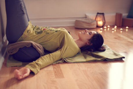 Attractive Mixed Race Woman Doing Restorative Yoga
