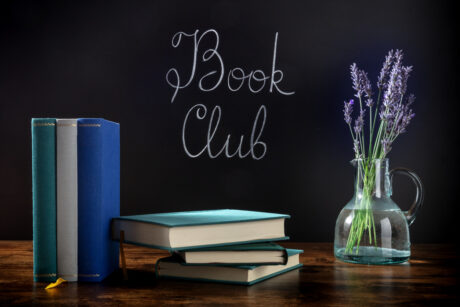 Book Club Concept. A Stack Of Hardcover Books With Chalk Lettering